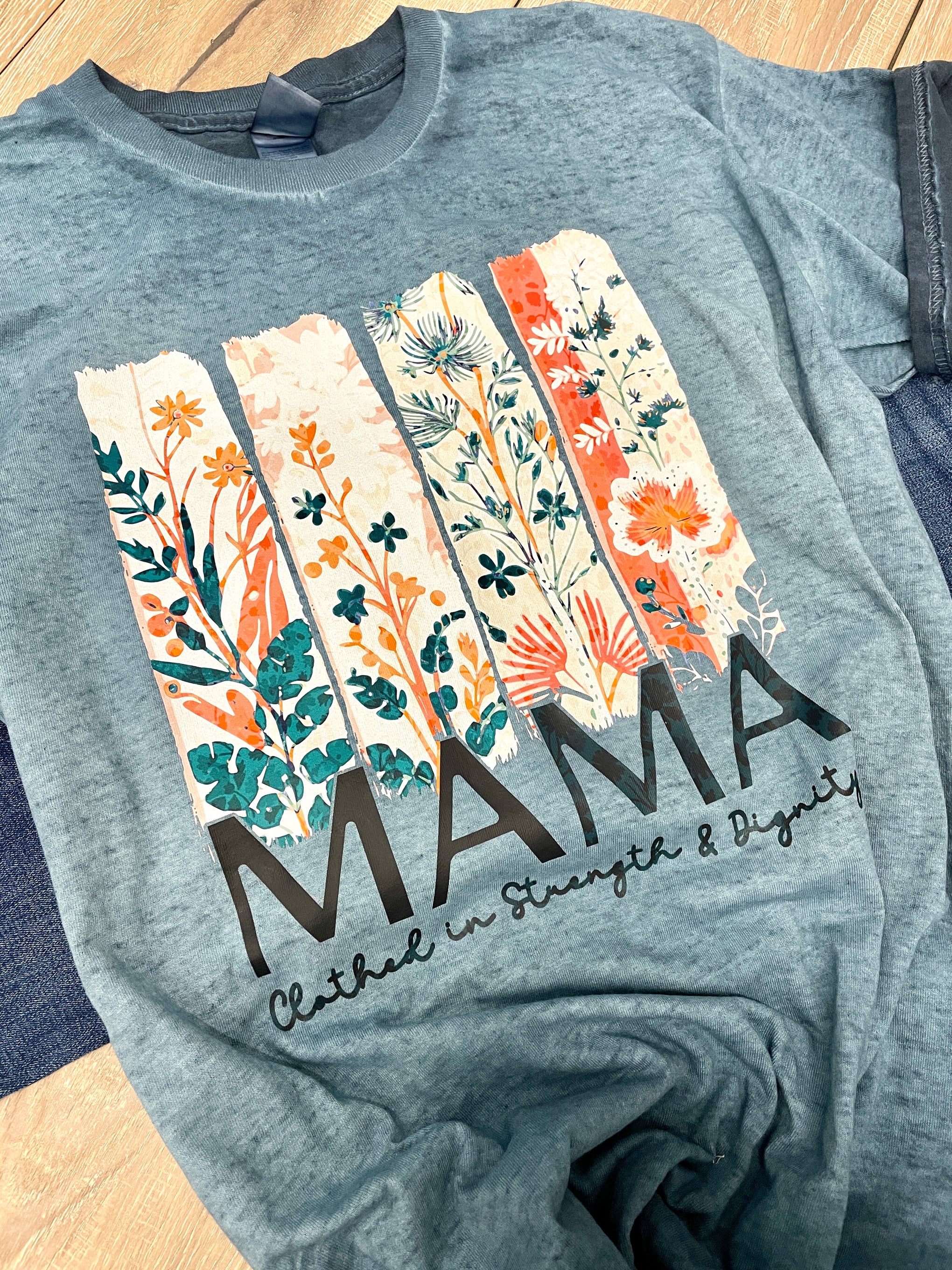 MAMA CLOTHED IN STRENGTH IN DIGNITY TEE